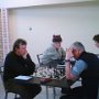 Ben Kersten (black) concentrates hard against Leigh Healey - while  Terry Mills takes on  James Watson